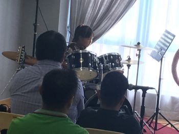 A young musician plays the drums at our Kuala Belait recital