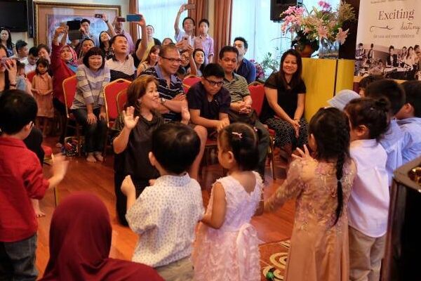 Young Toddlers performing at a music recital