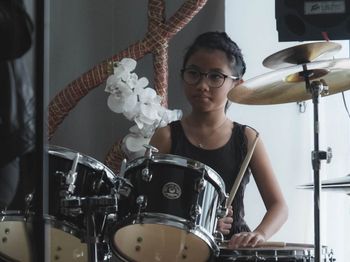 A young musician plays the drums at our Kuala Belait recital